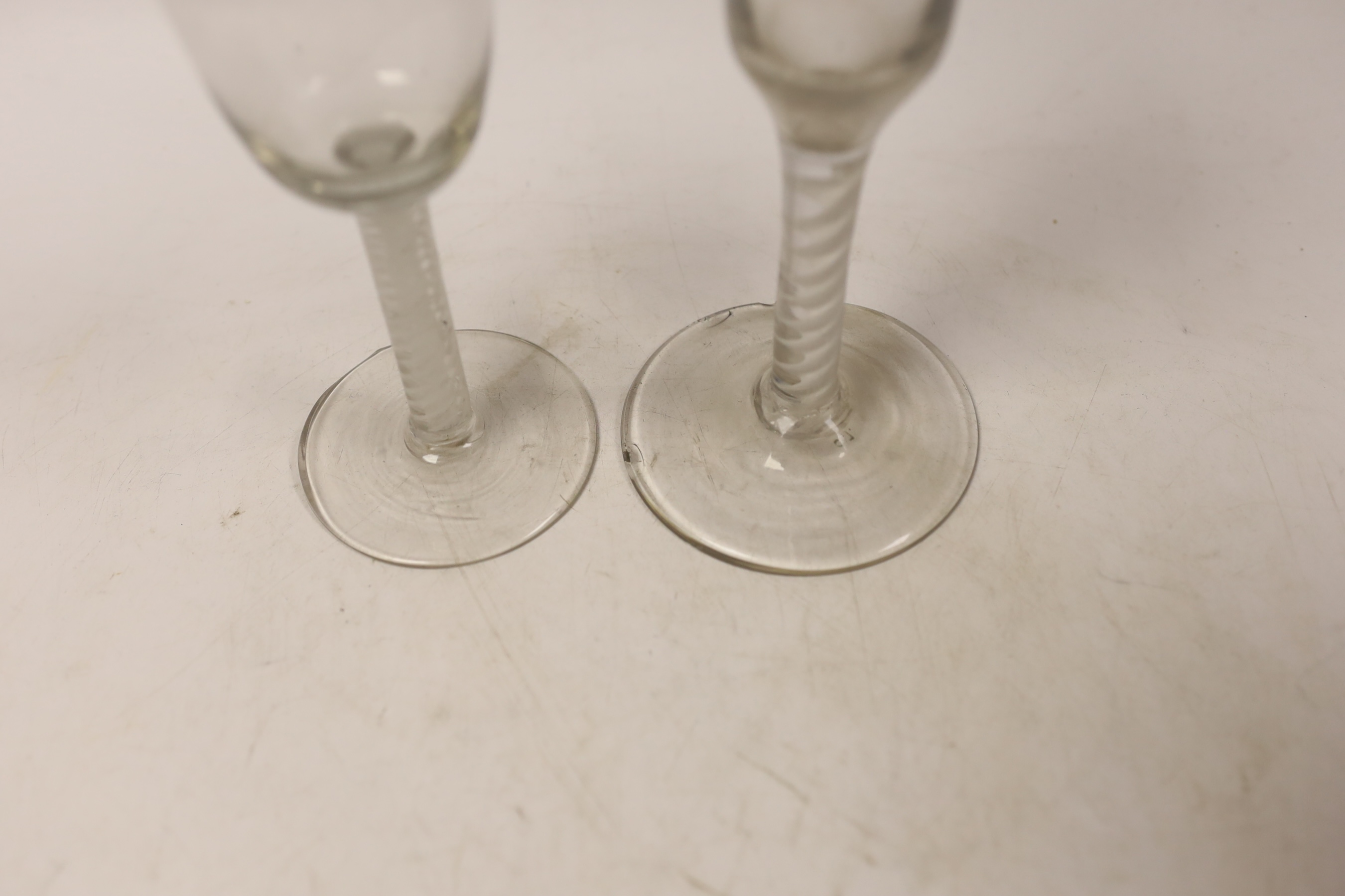 A George III DSOT stem wine glass, and single opaque twist stem ale glass, tallest 20cm
